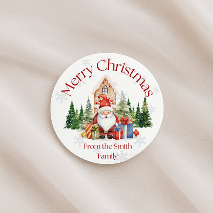 Round Christmas sticker with Santa Claus, presents, and trees on a beige background