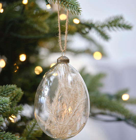 Pampas grass glass bauble hanging from Christmas Tree