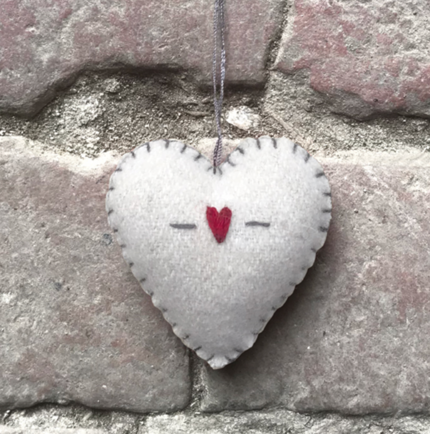 Small hand made embroidered felt heart